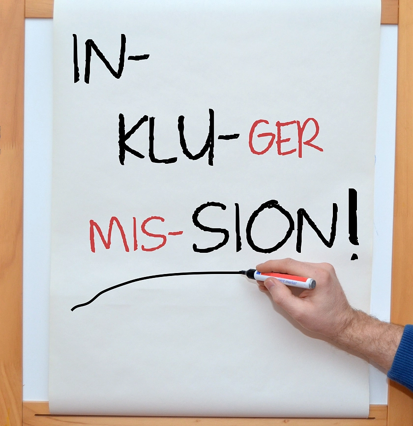 Wortspiel auf Flipchart: Inklusion - In kluger Mission